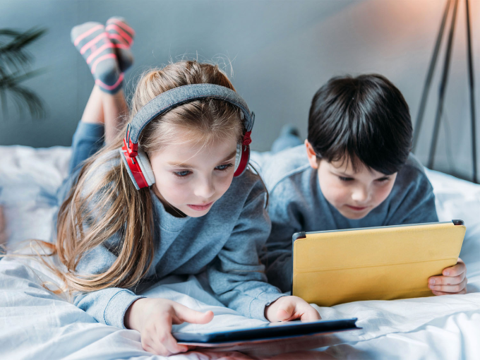 Image of parent setting screen time limits on a tablet